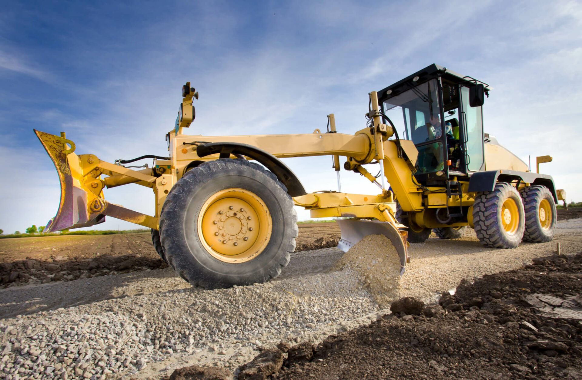 Grader working on road construction site